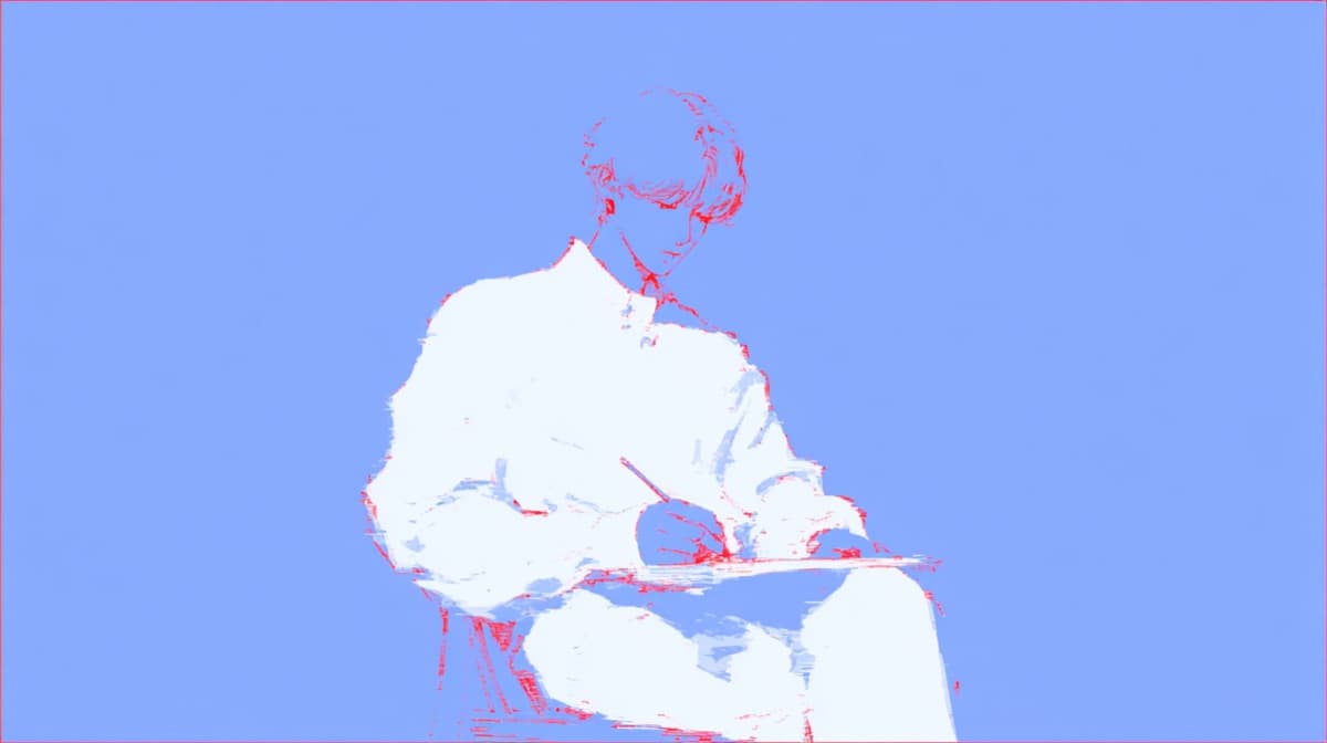 A person writing on a notepad